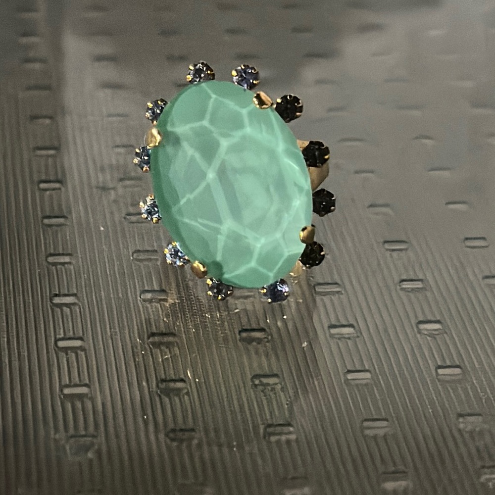 gold ring with green Gem